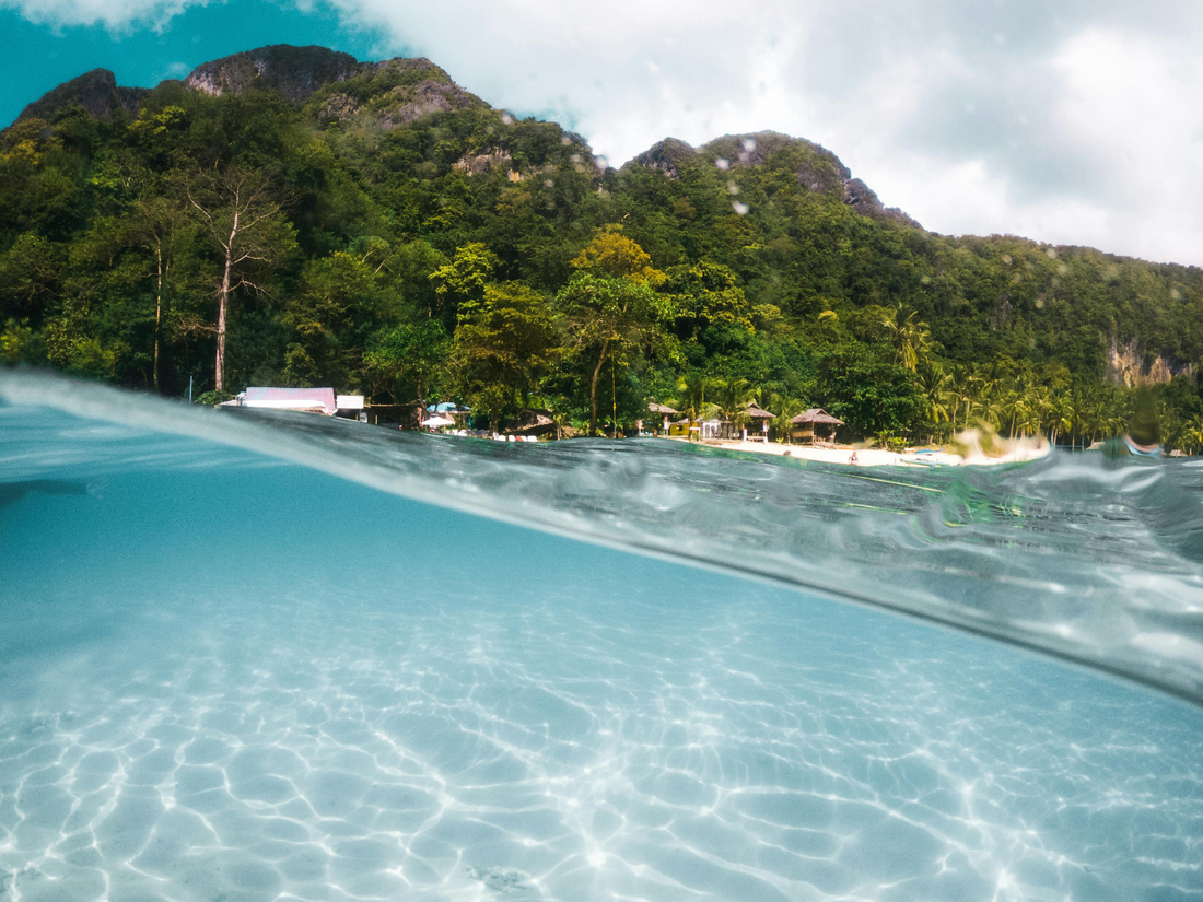 A durable and versatile inflatable pontoon by LuxeFloat, featuring teak-look non-slip decking, perfect for lounging, docking jet skis, or enjoying water adventures on Australian waters.