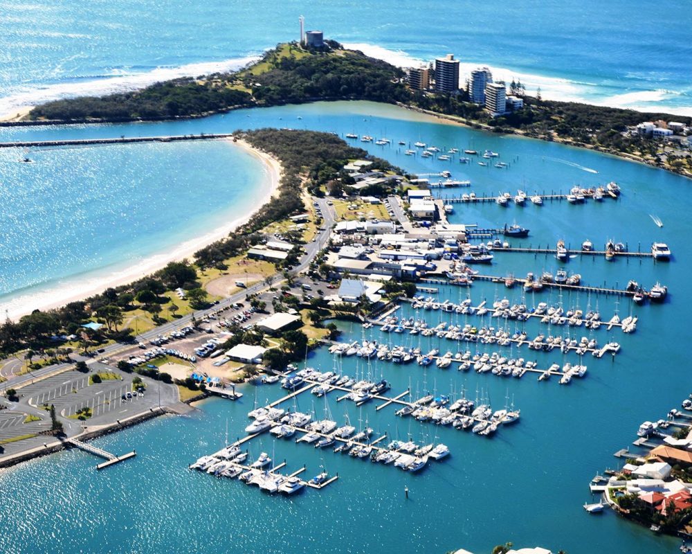 A LuxeFloat SeaHaven dock set up near a luxury yacht at Mooloolaba Wharf