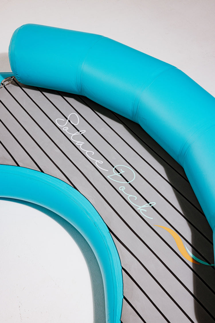 Crescent inflatable dock platform for group use on the water