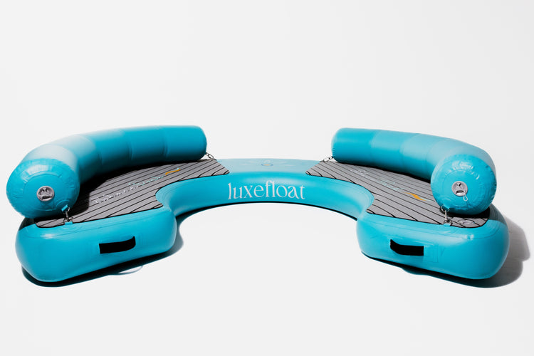 Curved inflatable hangout dock with teak-look surface and handles