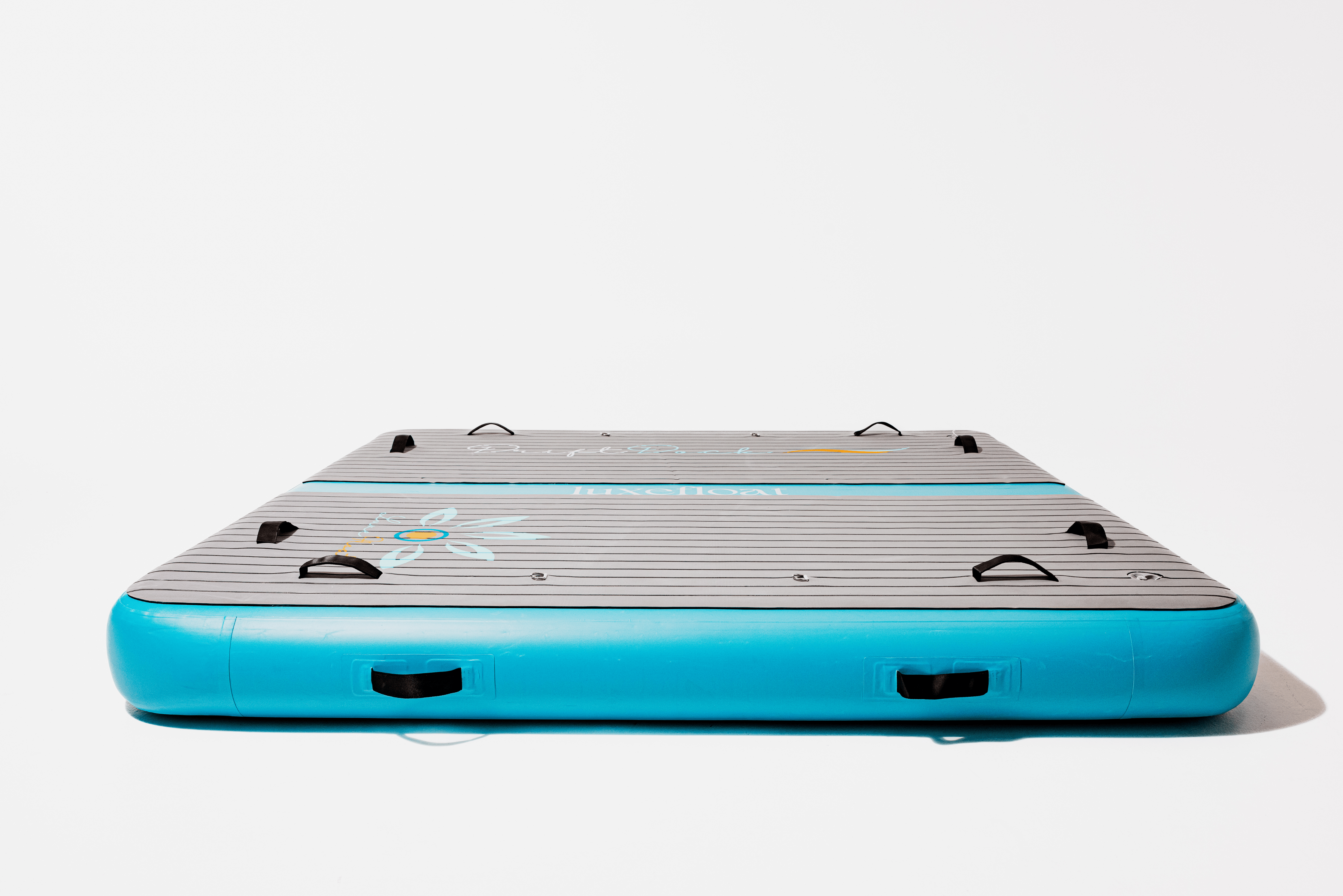 DriftDock water lounge pontoon floating behind a yacht